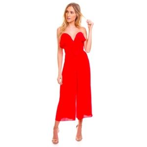 Red strapless wide leg jumpsuit in striking red by Amanda Uprichard.